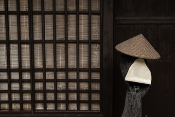 Japanese traditional wooden wall with tatami mat and bamboo hat