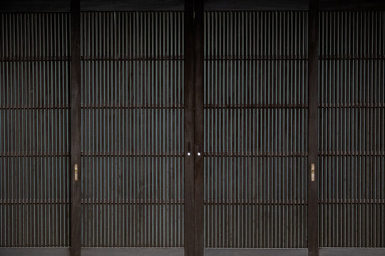 wooden wall of window and old house in Japan. low key and soft focus.