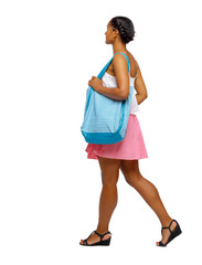 Side view of an African-American with a beach bag that goes to the side.