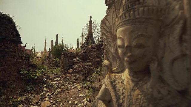 Aerial view of monastery, Couple of monks sitting on the monastery and looking the surrounding view.