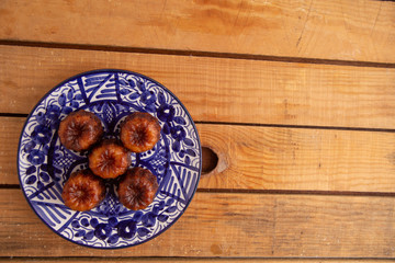 French pastry Caneles de bordeaux rum and vanilla flavor thick caramelized..