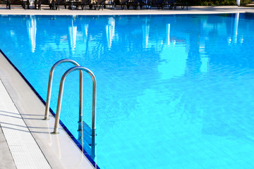 Fototapeta na wymiar Swimming pool with stair outdoor