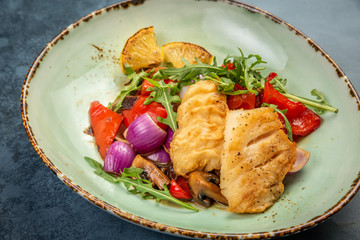 Pieces of fried fish with vegetables. Top view