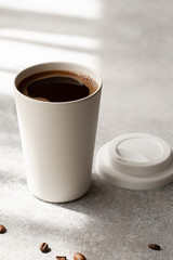 americano coffee in paper cup, morning natural light