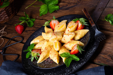 Fototapeta Kopytka - polish potato dumpling with strawberries obraz