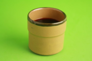earthenware glass filled with red wine