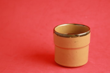 earthenware glass filled with red wine