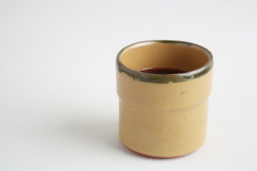 earthenware glass filled with red wine