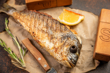 Grilled dorado fish on parchment