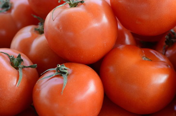 Red tomatoes background. Group of tomatoes. Full frame of cherry tomato on market.
