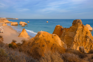 View on the beach Careanosy in Portimao with beautiful cliffs on the sunset. Vacation in Portugal.