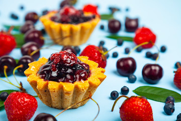 Small berry cake and ripe berries