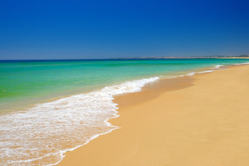 Fototapeta na wymiar Beach Alvor Poente in Algarve, Portugal.