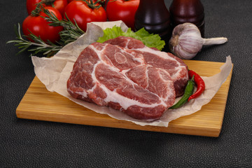 Raw pork neck steak