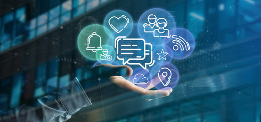 Businessman holding a cloud of social media network icon