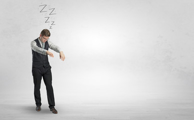 Tired businessman with sleeping sickness going somewhere
