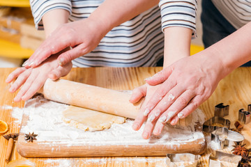 Pastry cooking master class. Cropped shot of woman teaching how to roll dough, make gingerbread biscuits.