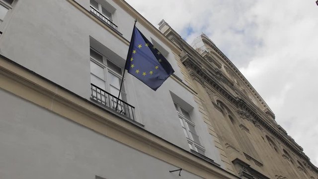 European Union flag on an unrecognized building in the center of Paris. France.