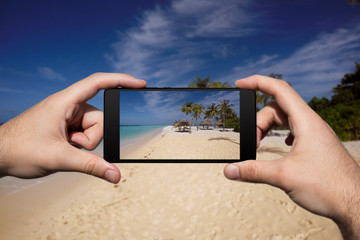 Photographing With Smartphone At Tropical Island Beach. Summer Vacation and Holidays