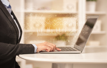 Business woman in homey environment using laptop with global financial report concept
