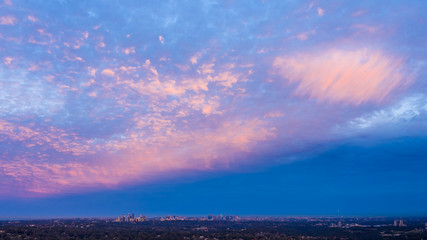 Soft pink sunset colors over the city of Sydney Australia