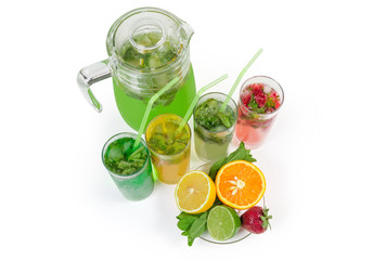 Cold mint drinks with fruit and berry on white background