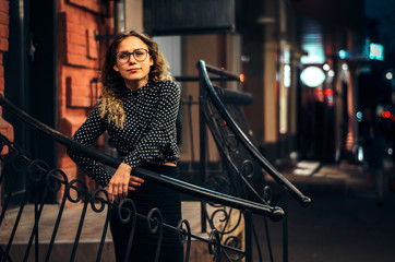 Pleasant beautiful girl on the evening walk