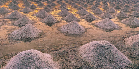 Sea salt farm in Thailand. Organic sea salt. Evaporation and crystallization of sea water. Raw...