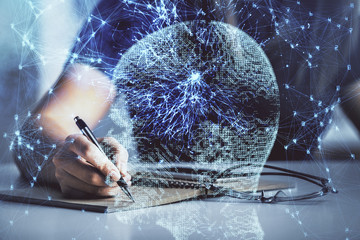 Multi exposure of woman's writing hand on background with brain hologram. Concept of brainstorming.