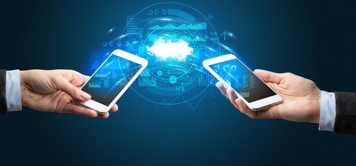 Two mobile phones syncing through the cloud