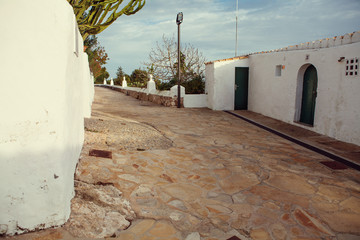 Old street with white Mediterranean walls on the Ibiza island - Image
