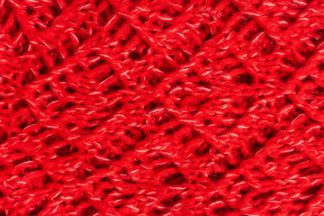 Red knitted woolen sweater texture. Colorful textured background. Horizontal image.