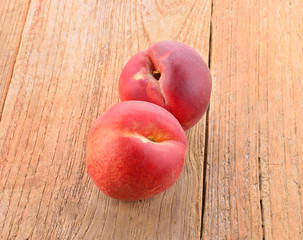 Closeup peach on a wooden background