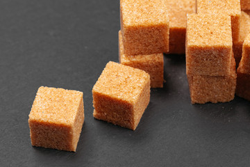 Rock sugar on dark background close up