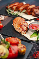 Marinated grilled healthy chicken breasts cooked on a summer BBQ