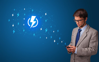 Young person using phone with power concept
