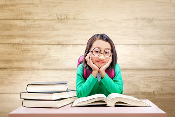 Asian cute girl with glasses and backpack with books on the desk