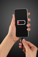 Elegant hand charging cellphone with low battery
