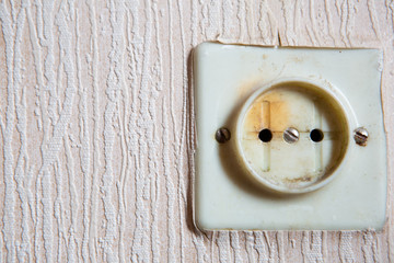 Electricity short circuit. Electrical failure resulting in old electricity socket burnt
