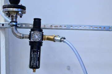Water pressure sensor in the water supply system. Pressure gauge mounted on piping system with...