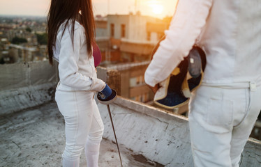 Fencing athletes people practicing outdoor on rooftop