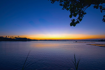 Naklejka na ściany i meble Beautiful sunsets on the edge of the lake