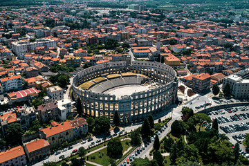 Pula Arena in Croatia and Pula city old town travel destination aerial view