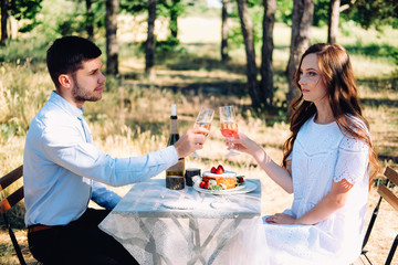 Couple of lovers celebrating their engagement at the dinner table