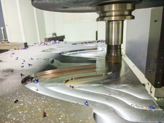 A process of cnc milling of lagre thick steel palte by curved trajectory, Selective focus with blur...