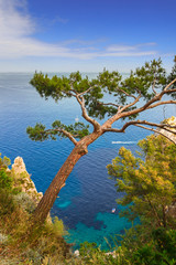 Mediterranean sea with alone boats on blue water, Capri island, Italy