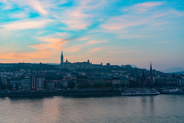 Sunset view of the Matthias Church and River Danube bank