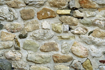 Ancien mur de pierre ocre.