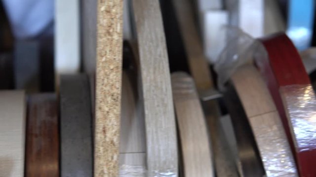 Furniture accessories. Multi Colored bobbins of PVC edge and melanin for the manufacture of furniture. Close-up