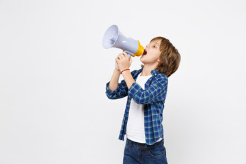 Fun little kid boy in blue t-shirt hold scream in megaphone, announces discounts sale isolated on white wall background children studio portrait. People childhood lifestyle concept. Mock up copy space